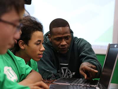 Celtics Player with Students at SNHU Tech Lab